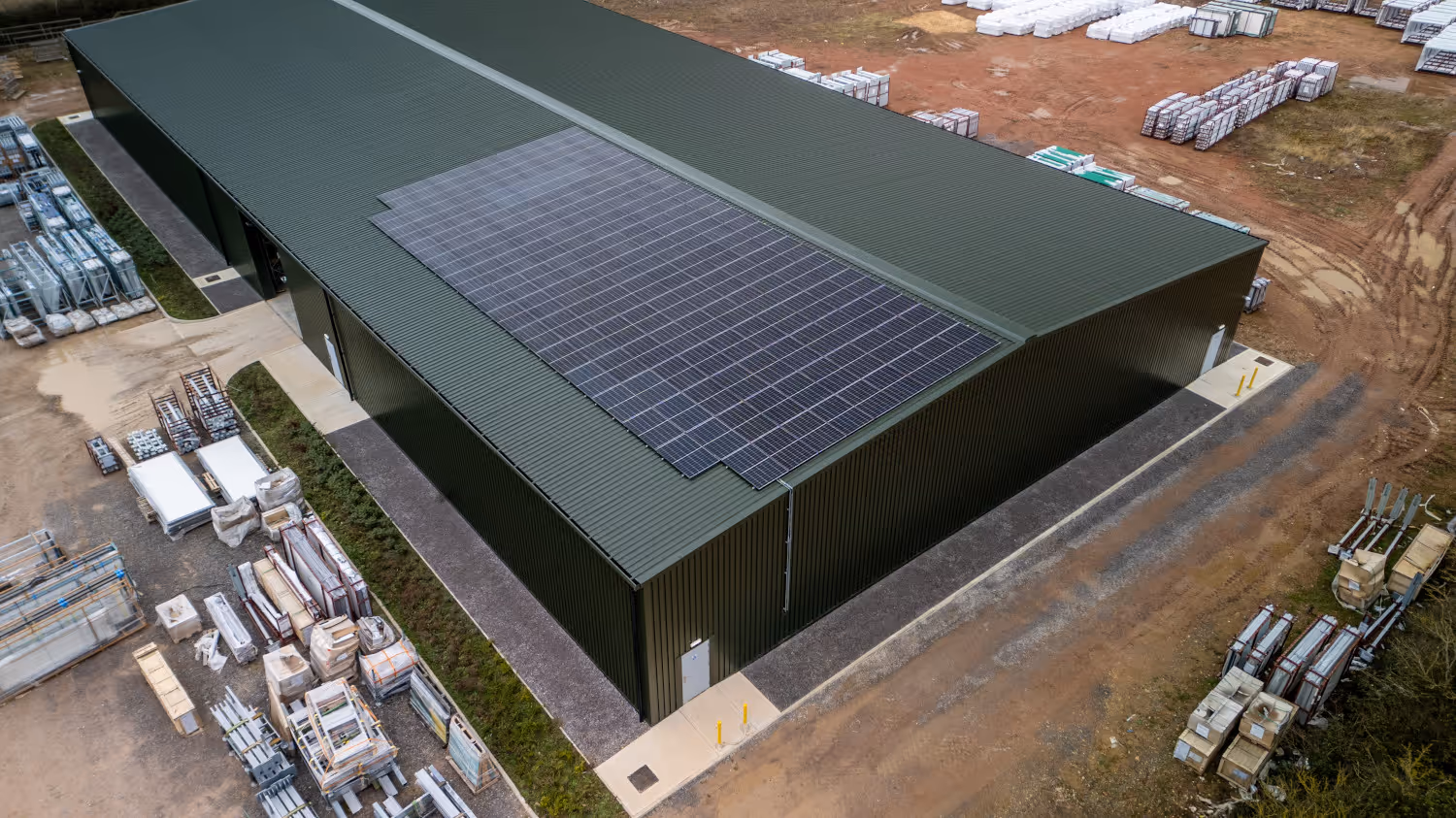 An aerial view of the Bauer Media Outdoor UK depot in Sawtry, featuring a large solar panel on top