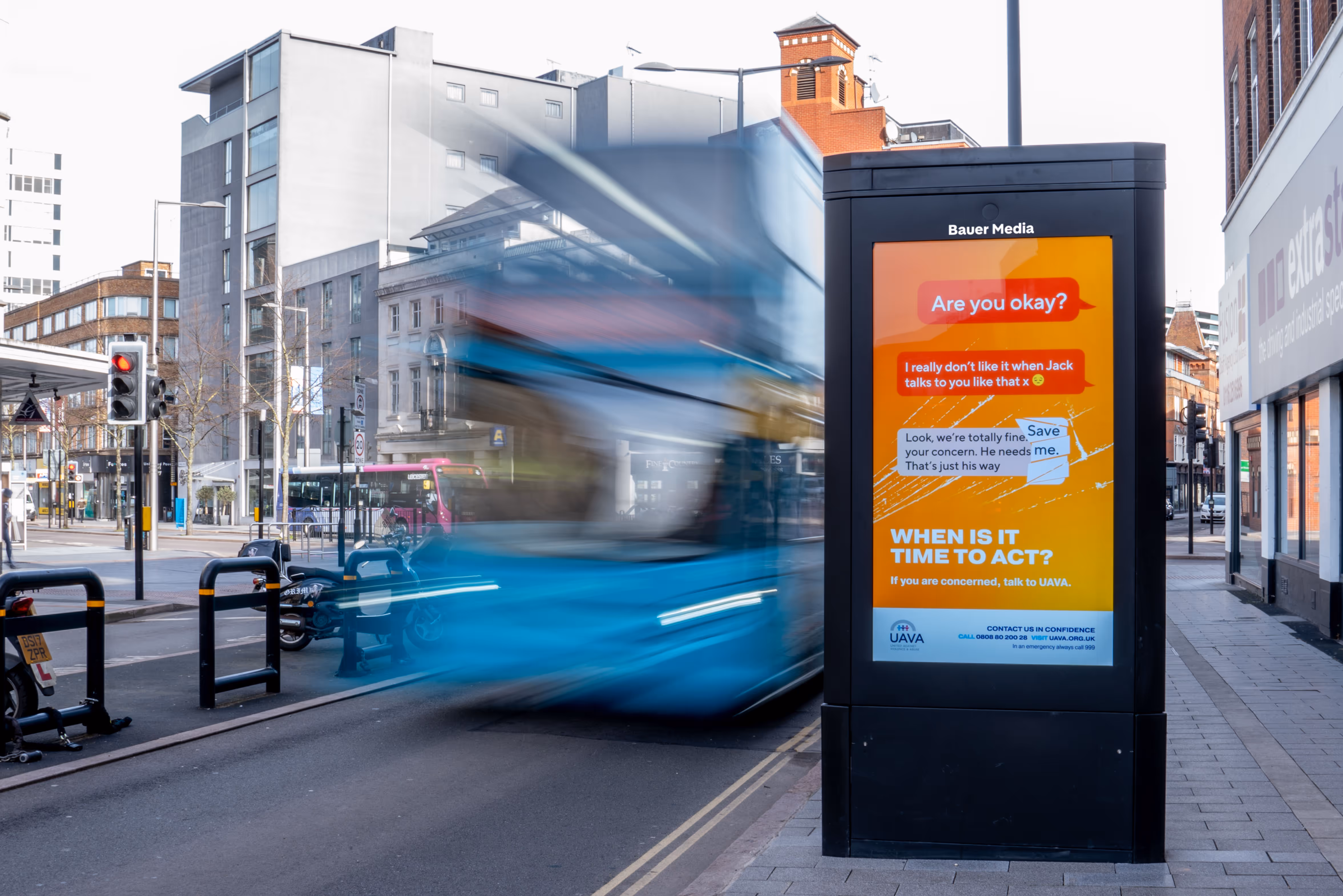 UAVA advertising a 'are you ok?' ad campaign, with a bus driving past