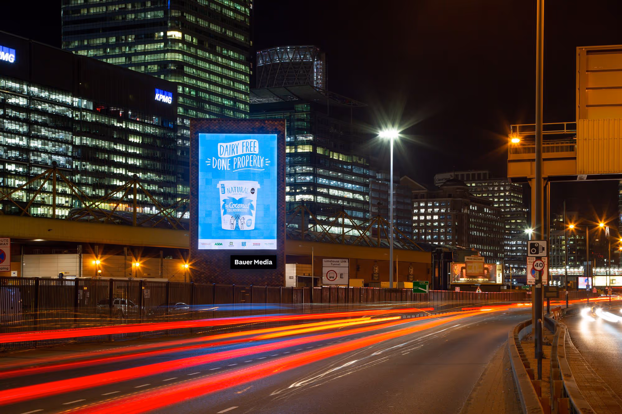 A large Dairy Free blue ad campaign on a Storm screen in London