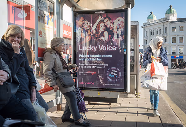 A local Karaoke advert on an Adshel Live panel