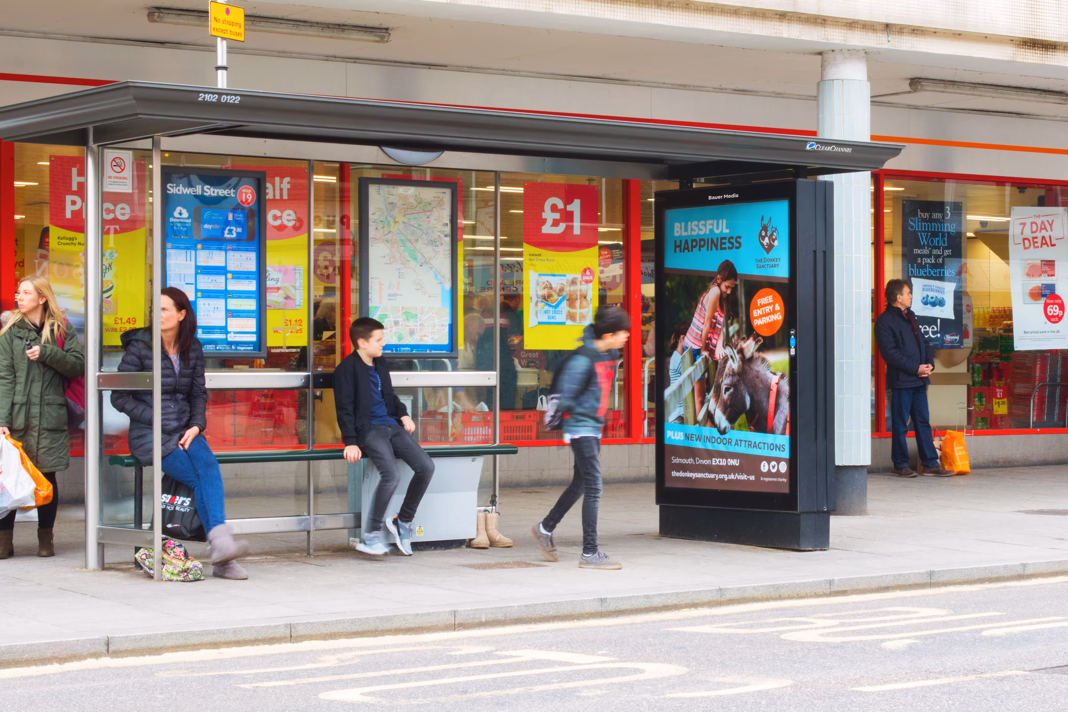 The Donkey Sanctuary advertising on a bus stop poster