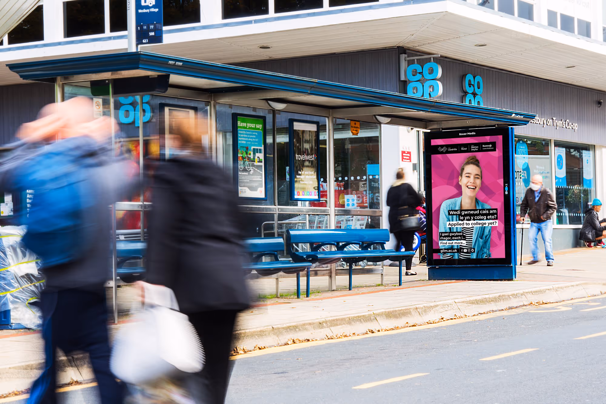 North Wales advertising bus stop poster outside of a Coop