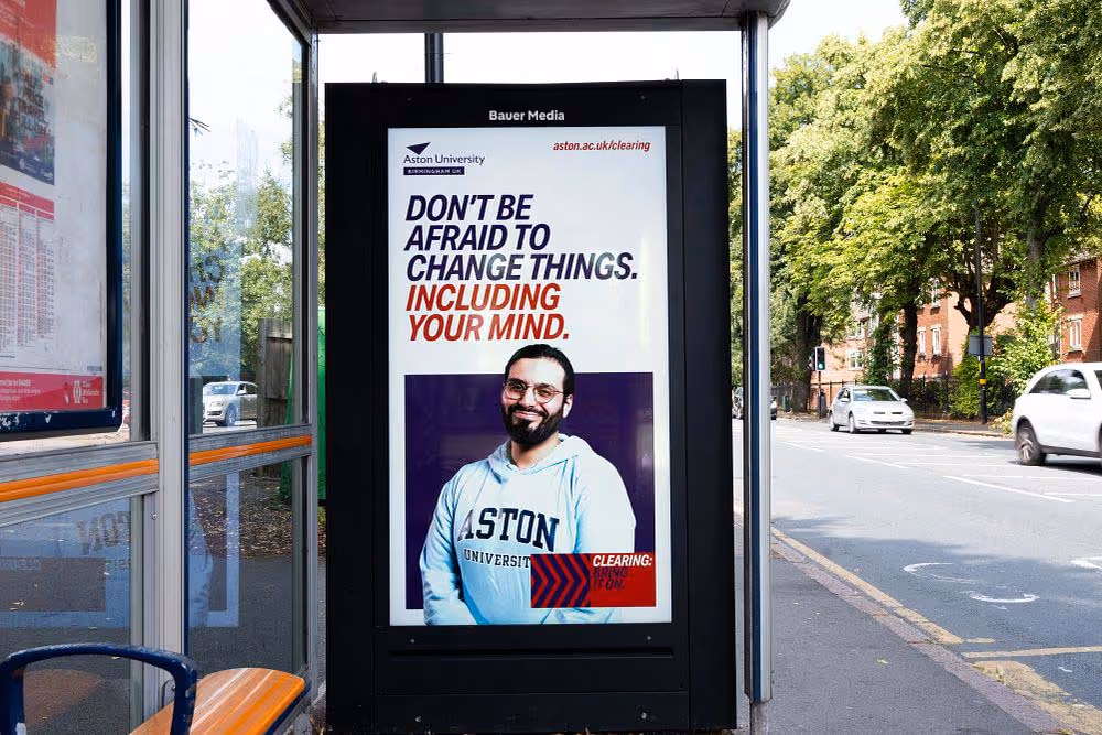 Aston Uni displaying their campaign on a digital bus stop in Birmingham