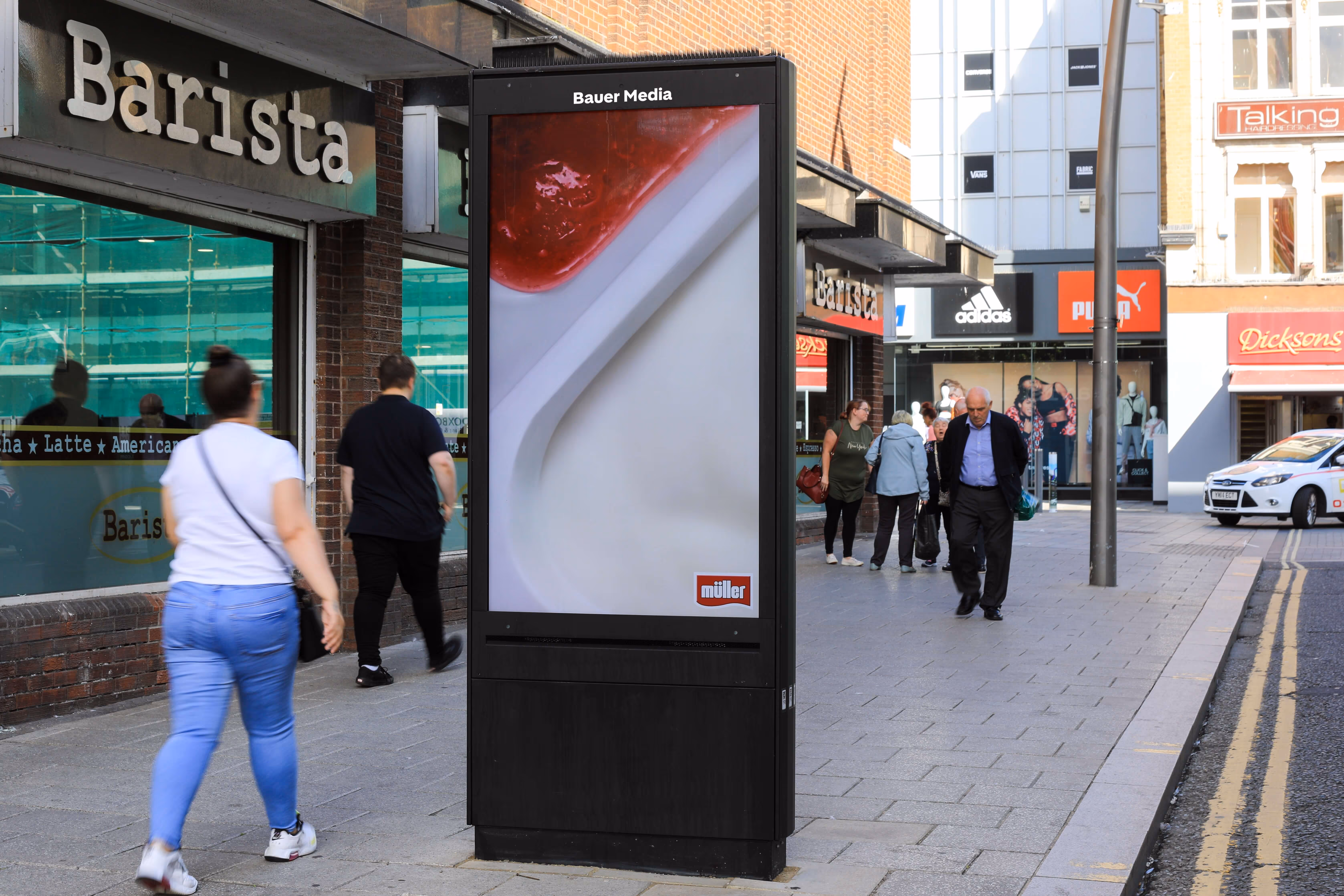 Muller Corner advertising their brand campaign on a roadside digital screen
