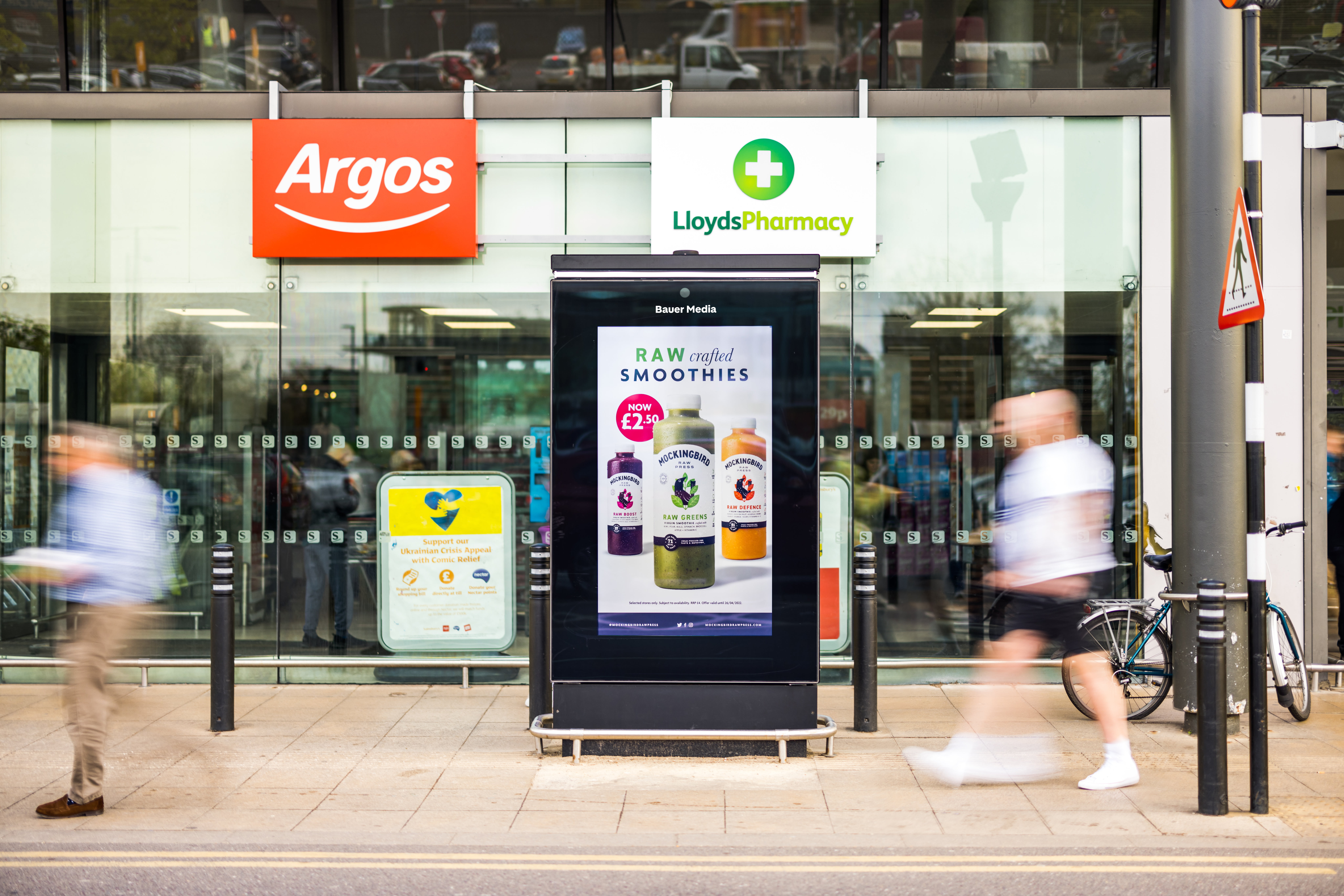 Mockingbird smoothie ad outside Sainsbury's with people walking past