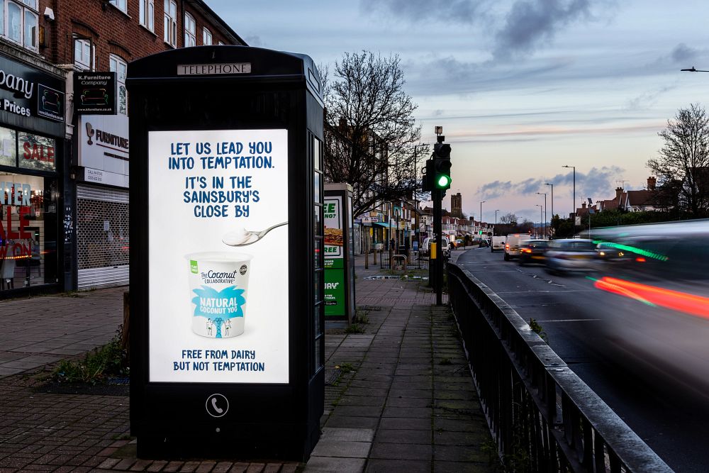 Coconut Collaborative advert featuring on an Adshel Live screen next to traffic