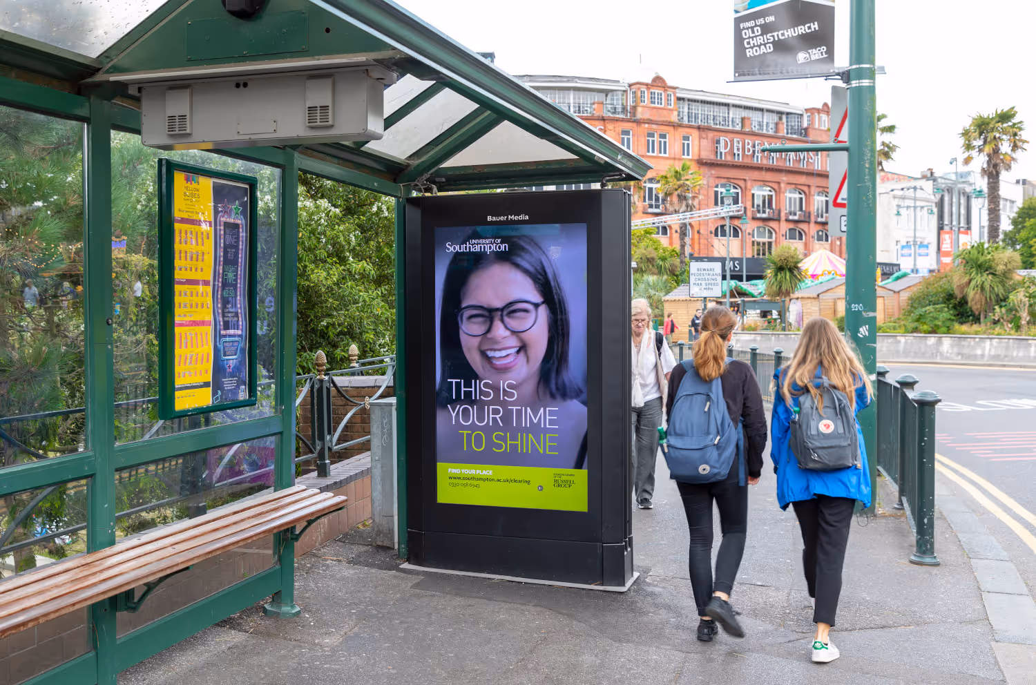 A digital bus stop screen in displaying Southampton Uni