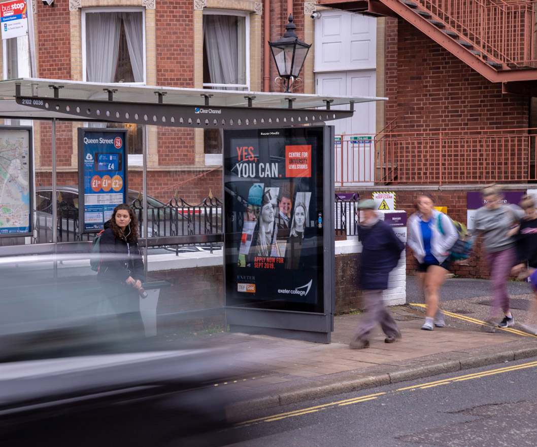 A bus stop advertising poster in Exeter
