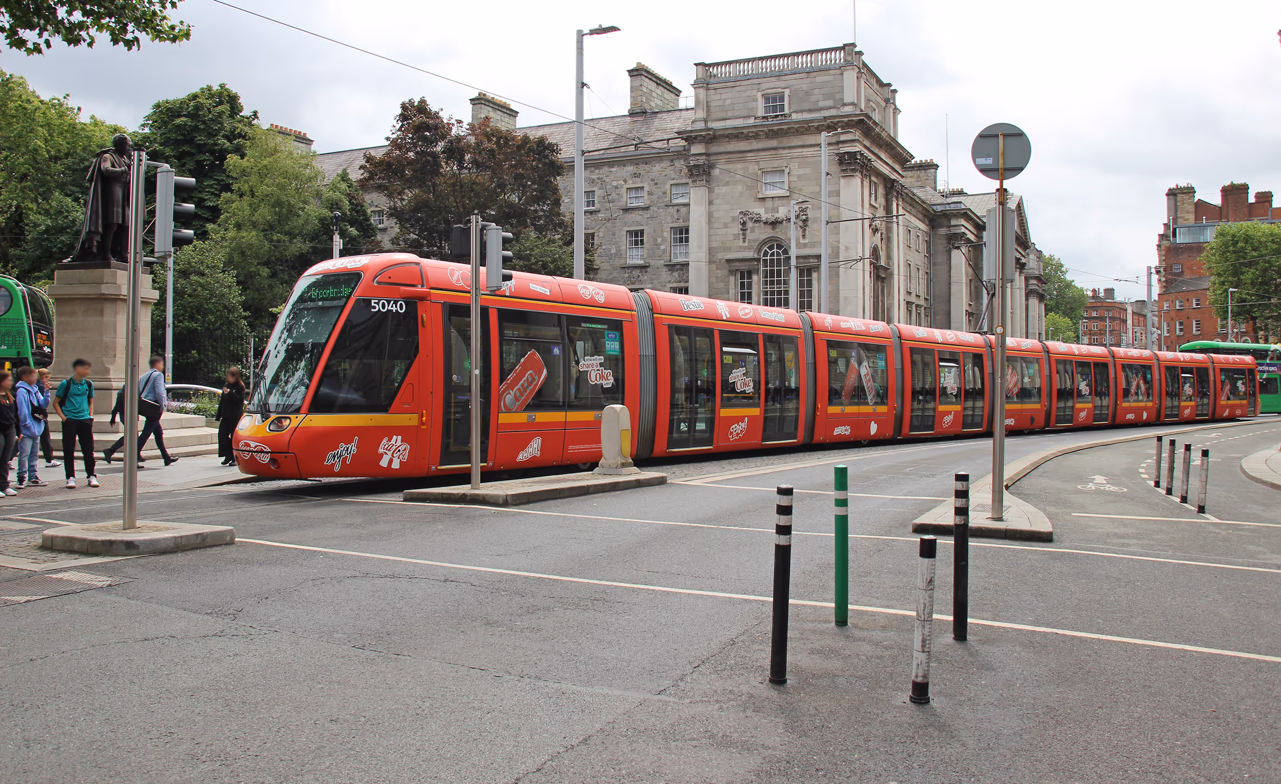 A Luas Full Wrap for Coca-Cola, passing through Dublin city centre past Trinity College