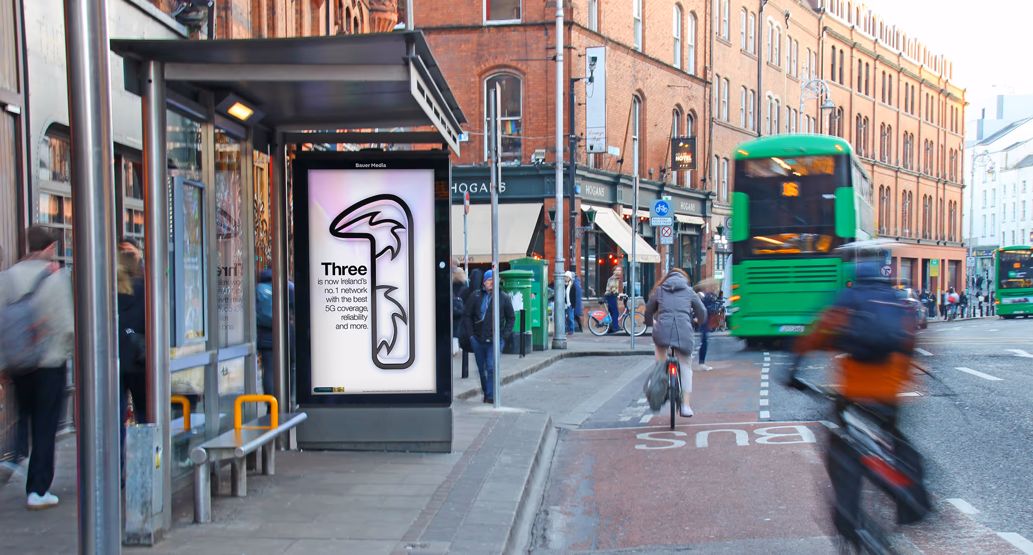 An Adshel Live digital bus shelter on a busy Dublin City centre street