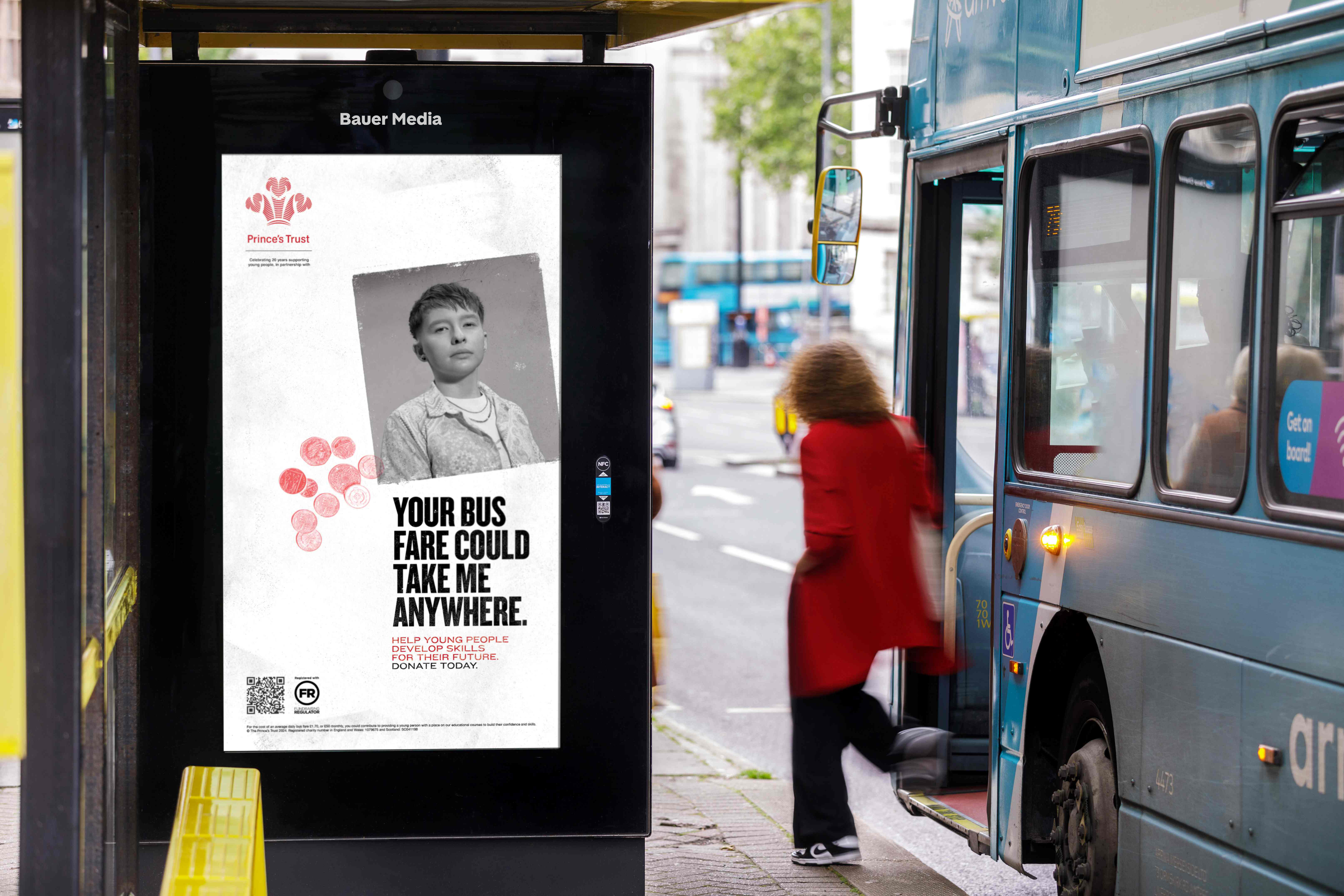An advert for the ‘Class of Covid’ campaign is displayed at a bus shelter, as a woman departs the bus on the street, in the middle of the day