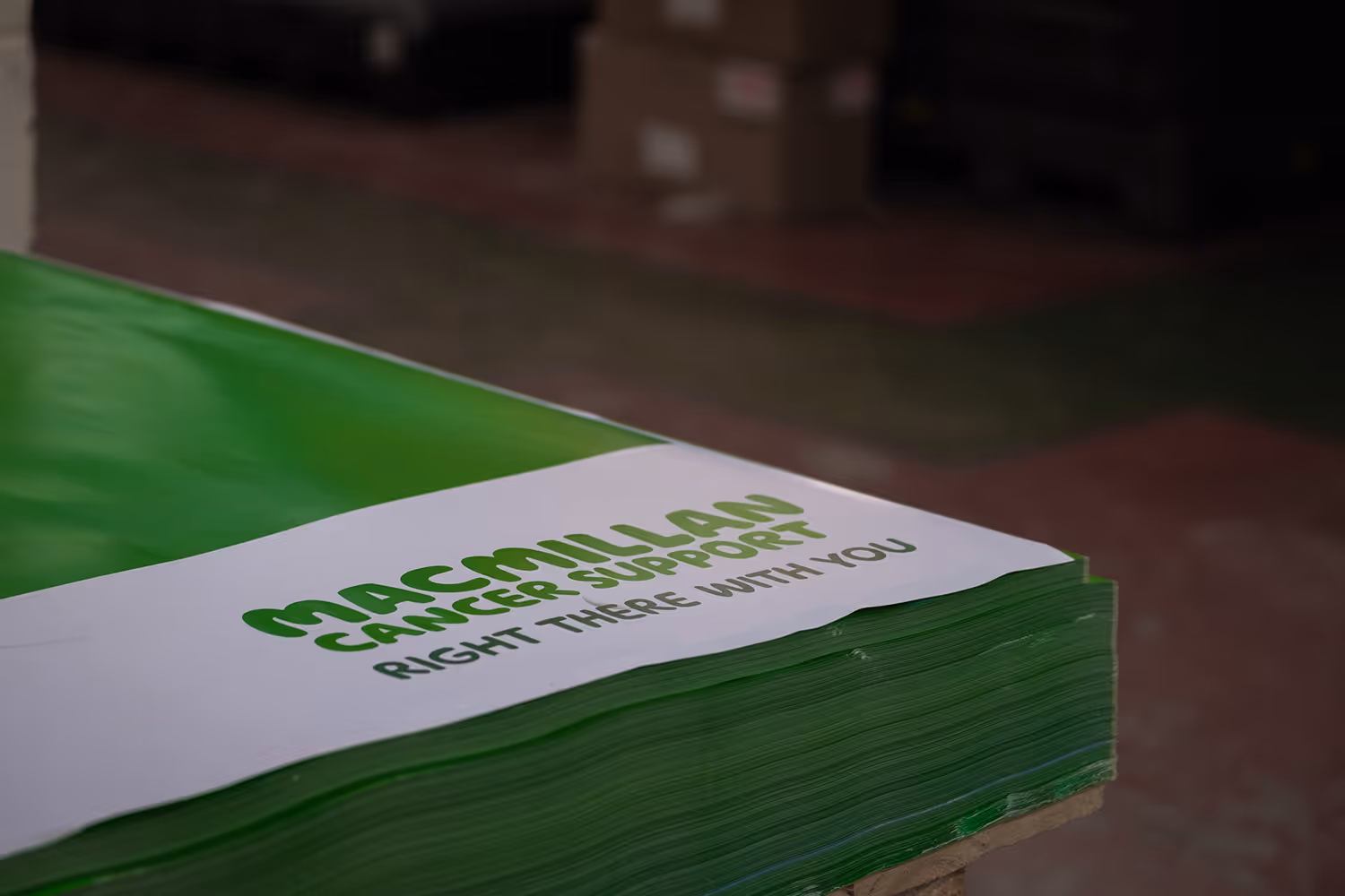 Macmillan cancer support poster in a depot