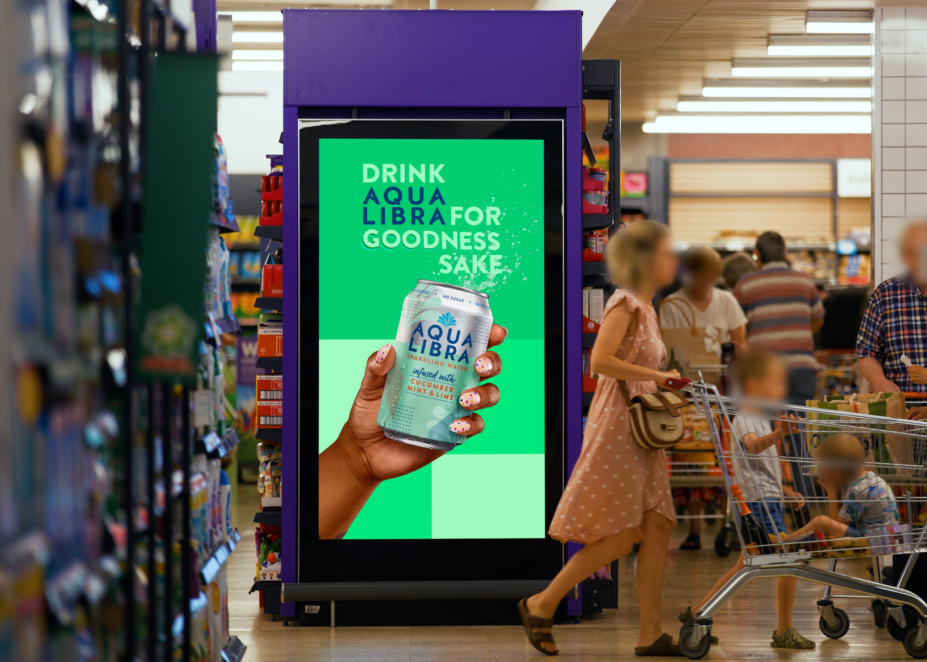 A digital advertising screen inside Sainsbury's supermarket