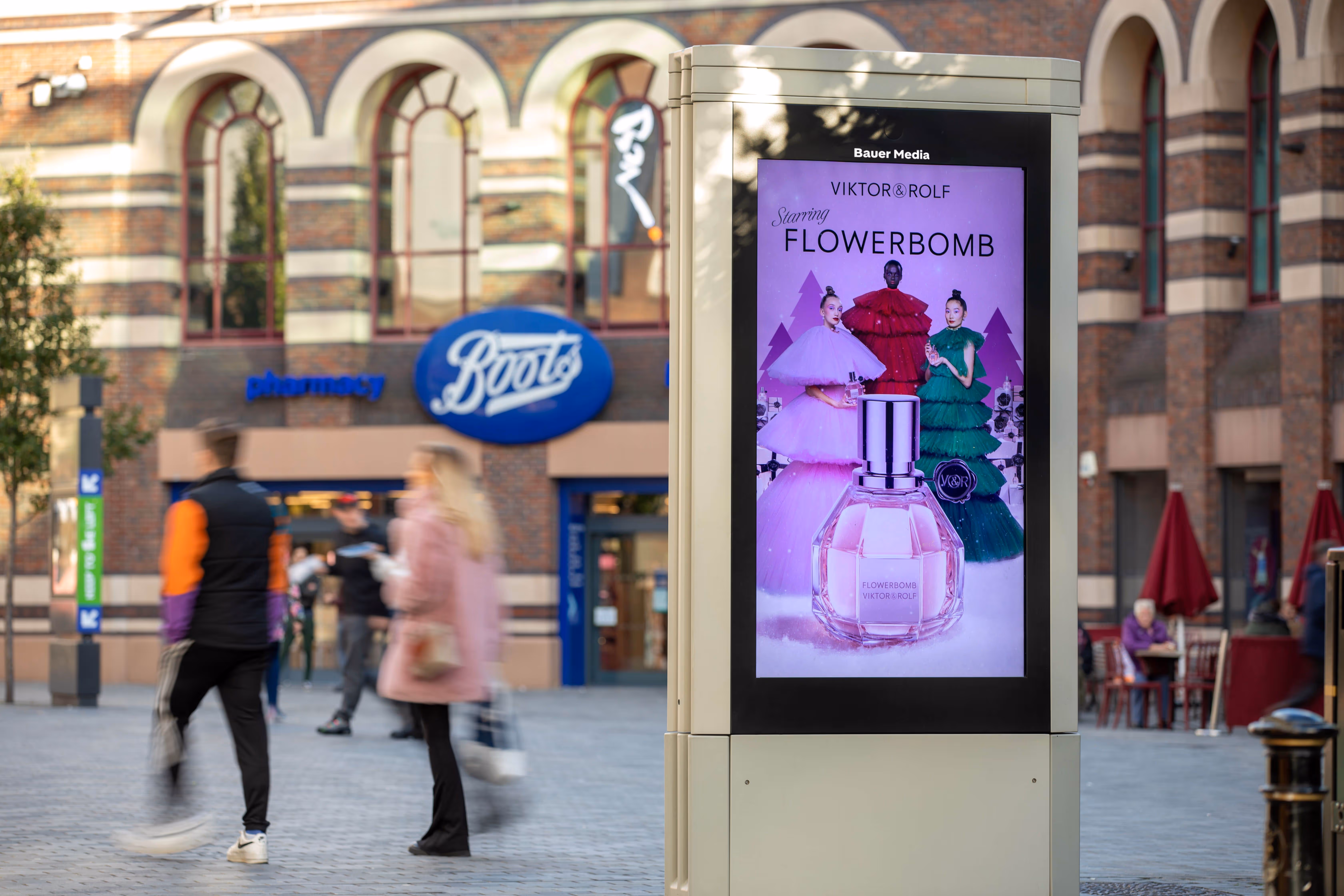 Adshel Live advertising screen in proximity to a Boots store