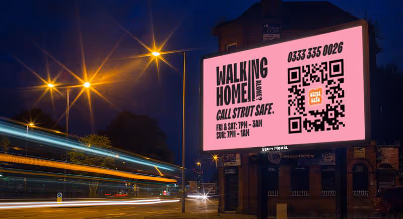 Digital billboard promoting Strut Safe service to help people feel safer at night