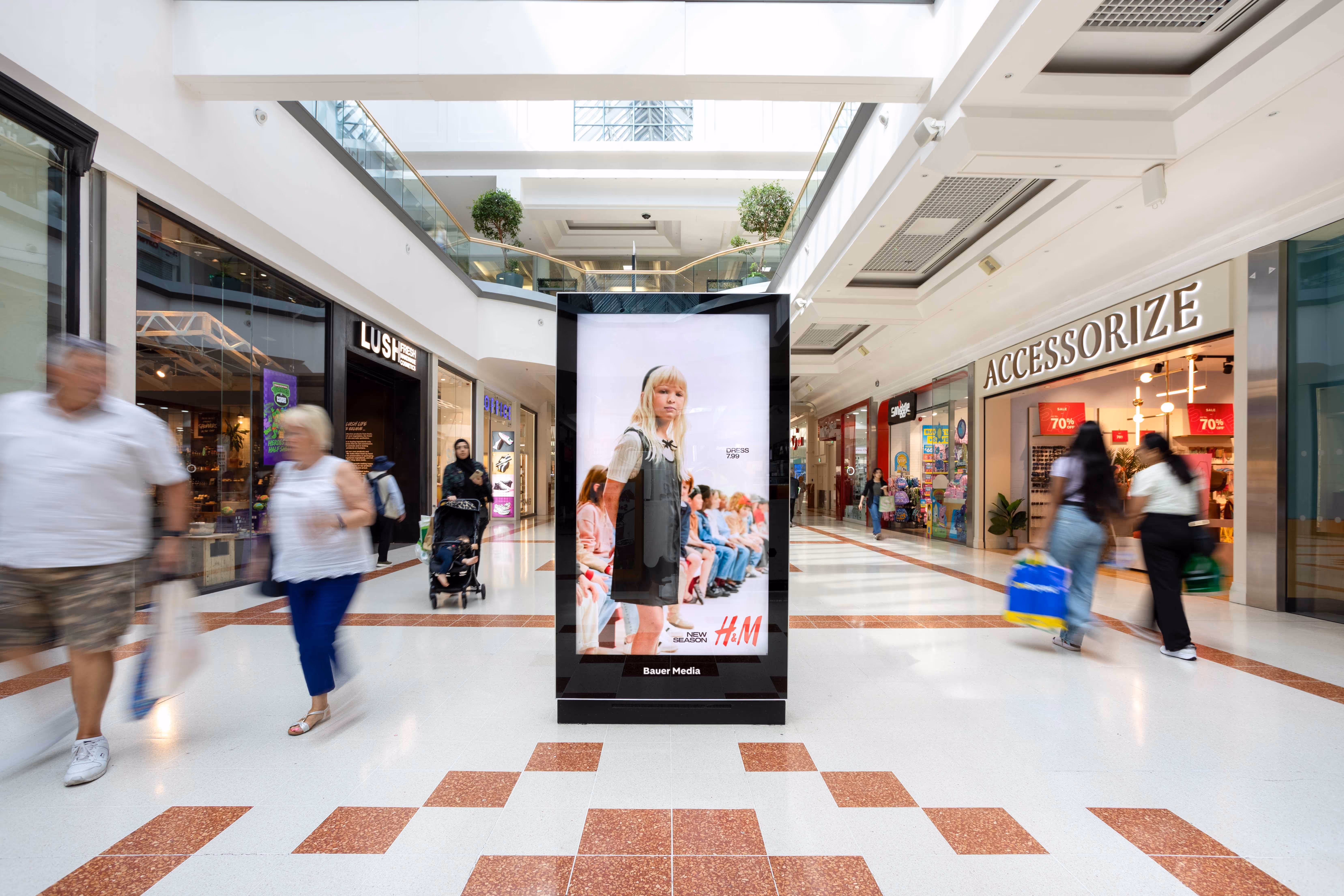 A digital screen in a shopping mall