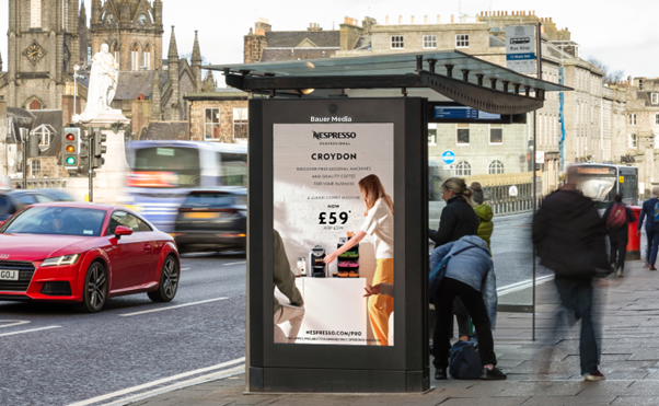 Nespresso advertising on a digital bus shelter screen