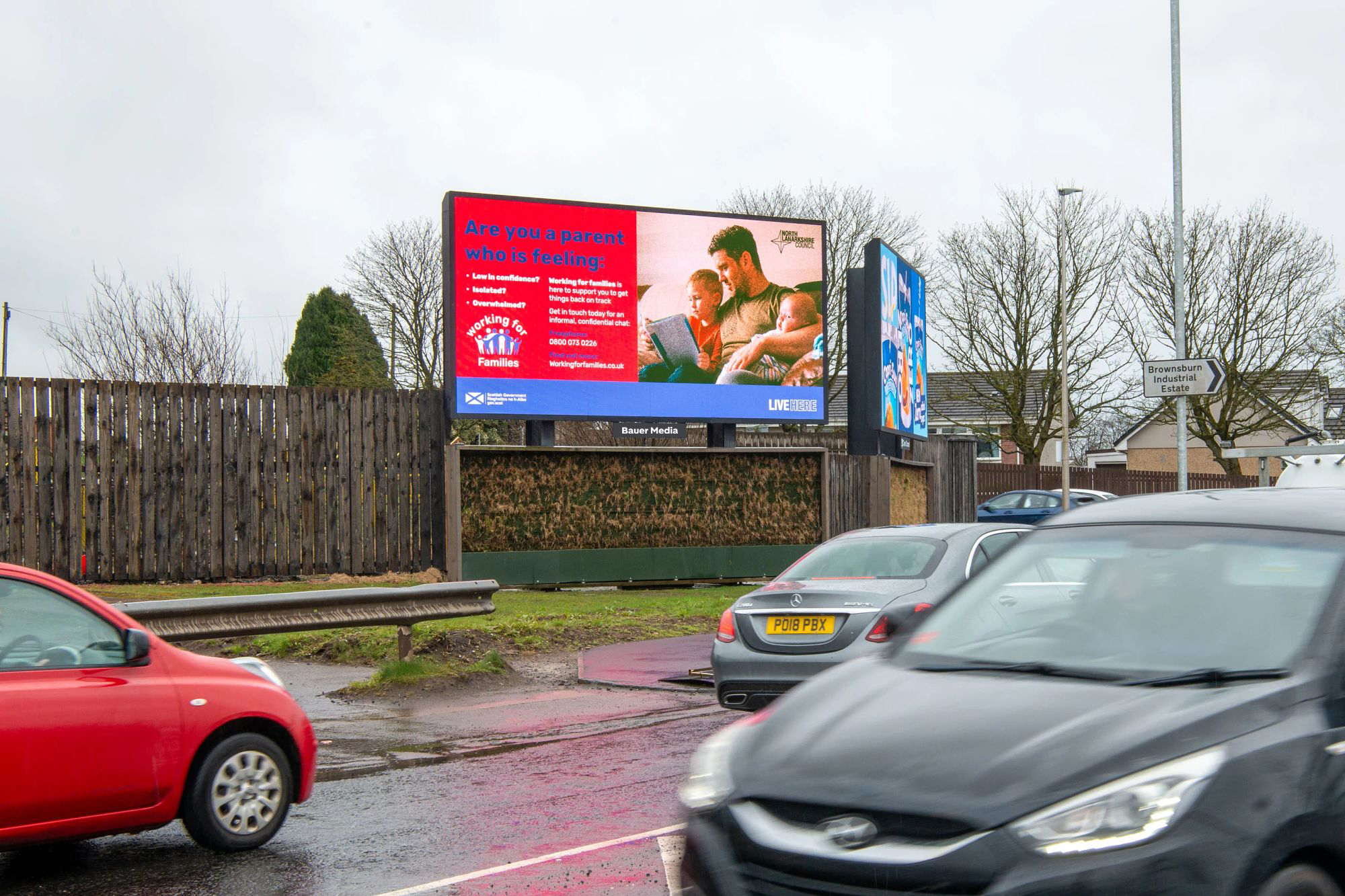 Digital billboard with traffic going by