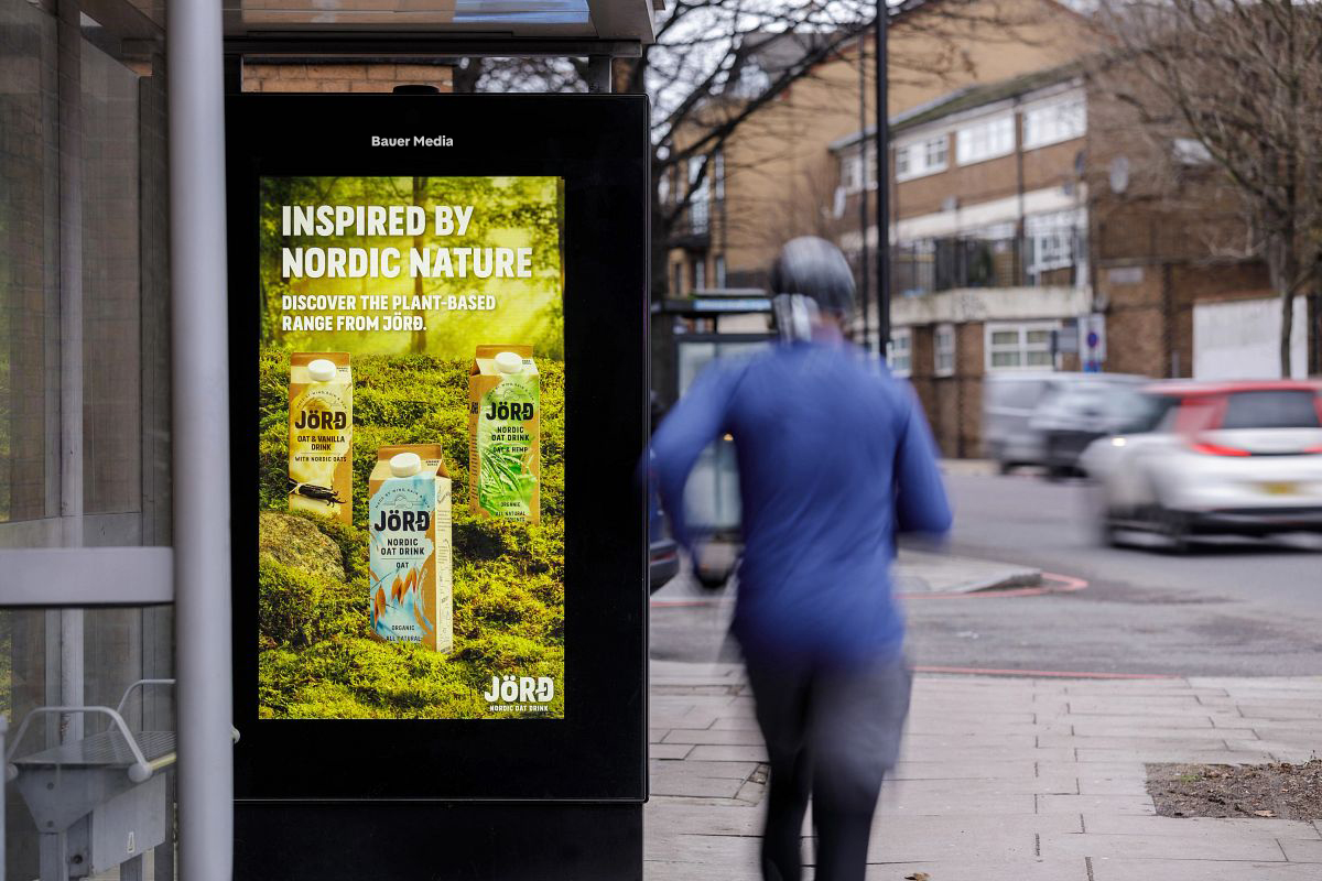 A roadside bus shelter digital screen