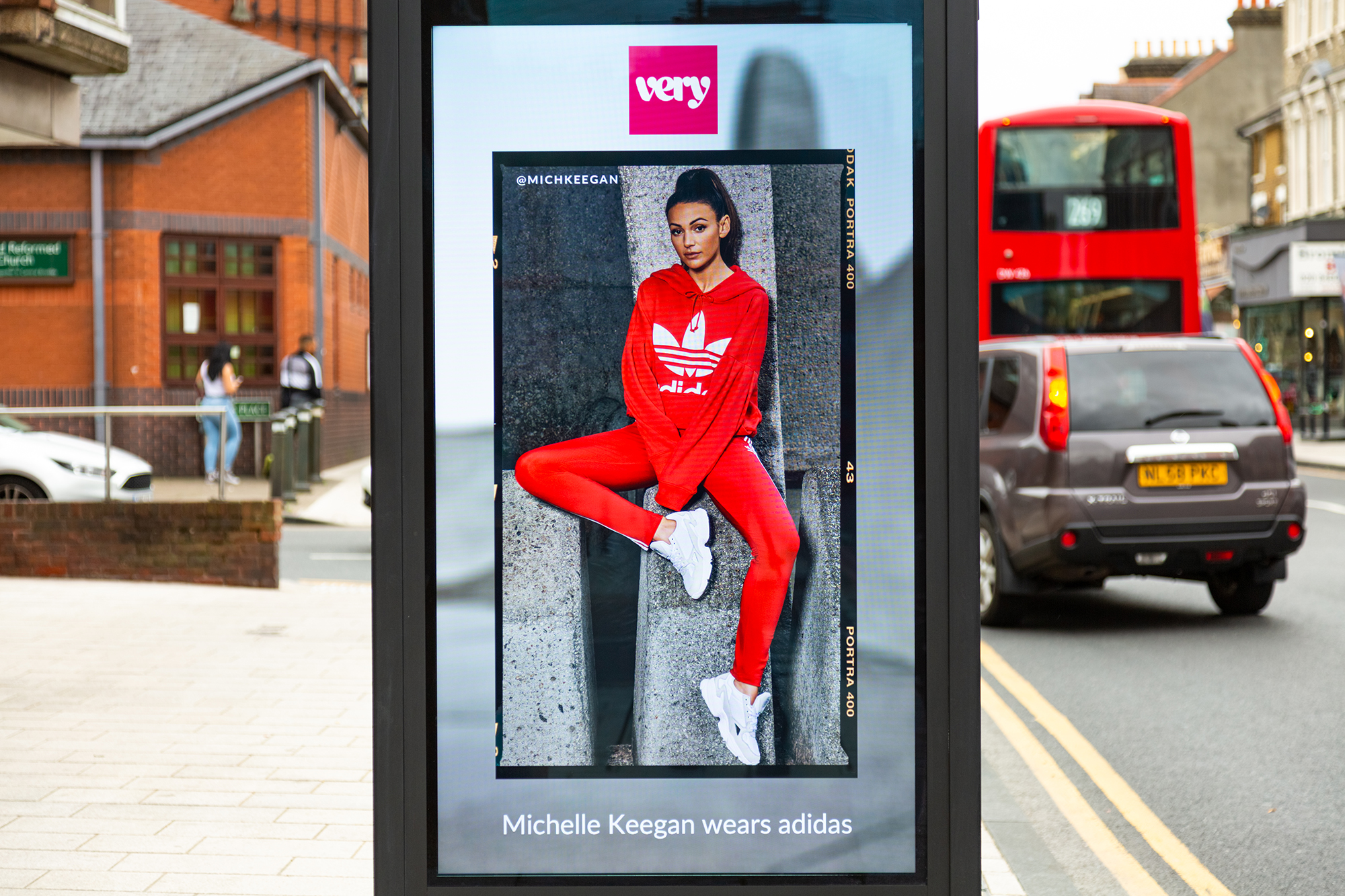 A retail brand advertising on a high street digital screen