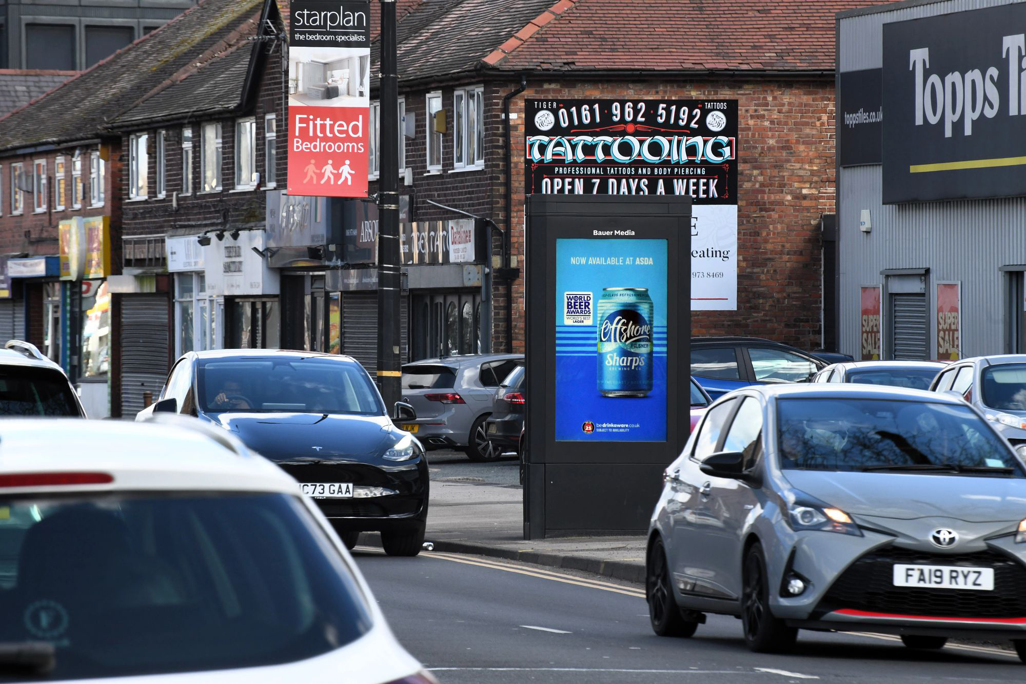 A beer campaign displaying on a digital roadside screen