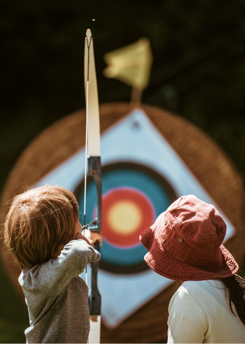 Two children who shoot bows