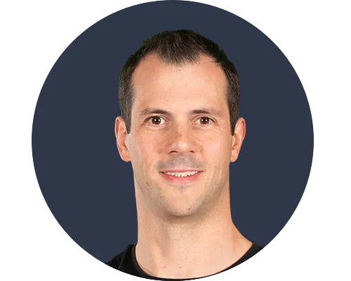 A person inside a circle with a dark background.