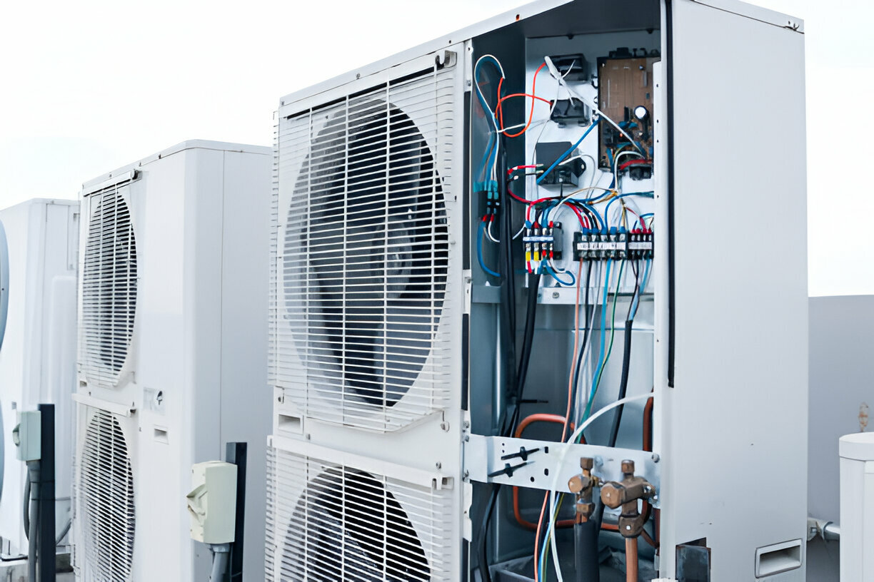 Industrial air conditioning unit with exposed electrical wiring and components