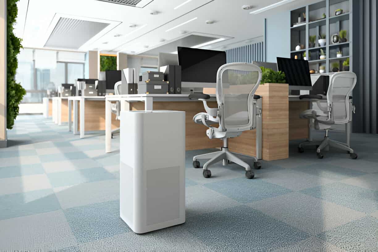 Modern office interior with air purifier, workstations, and plants