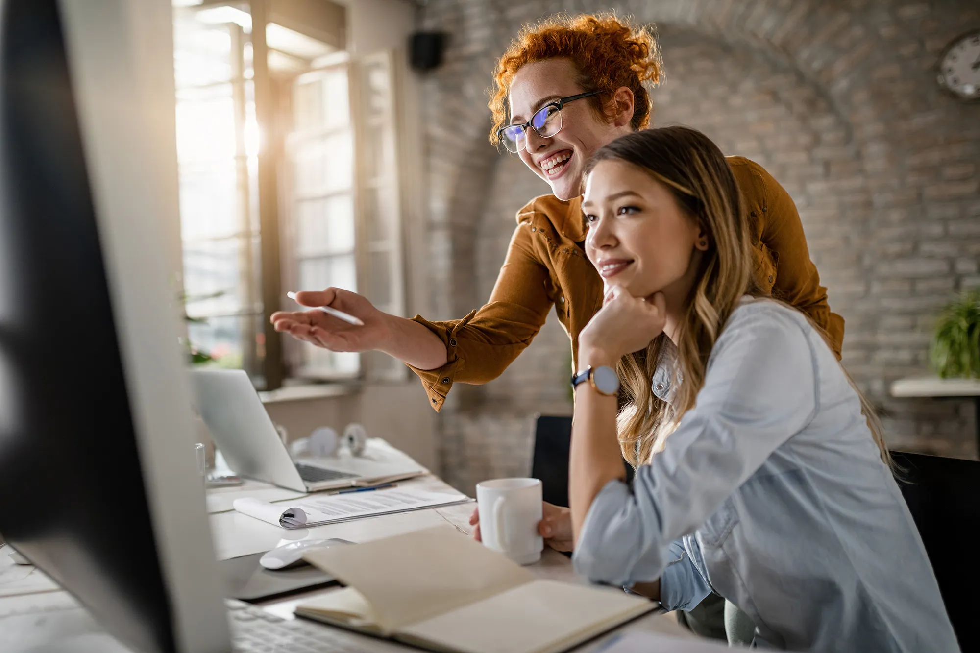 Happy women working in the office