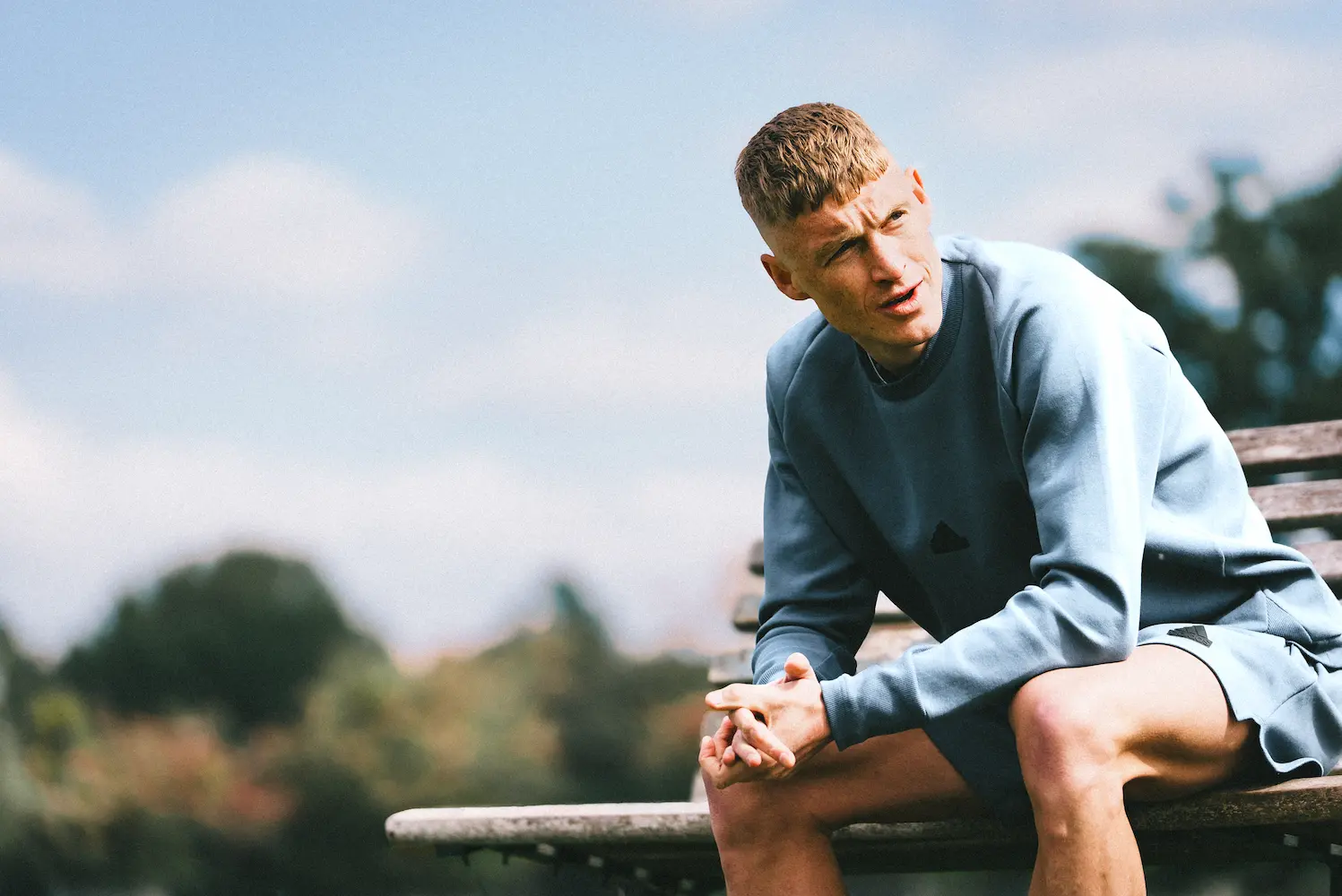 Adam Clarke sitting on bench