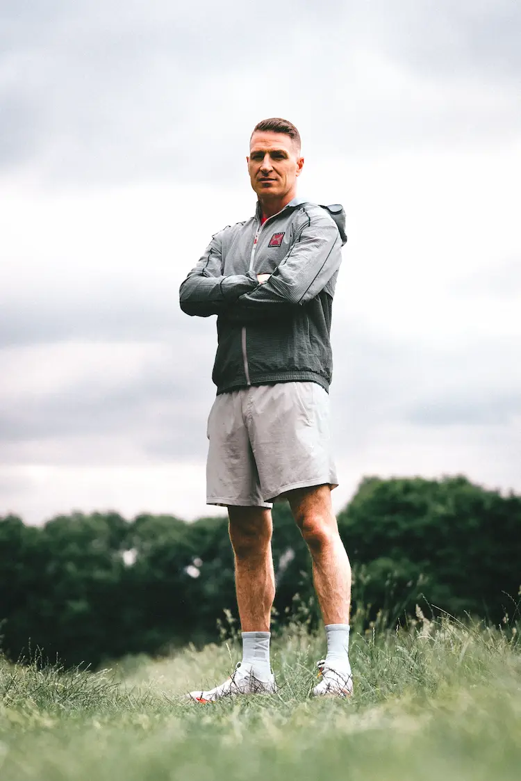 Rory Knight standing crossing arms