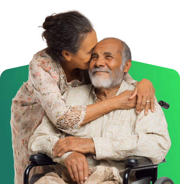 Photo of an elderly woman embracing her husband in a wheelchair, symbolizing the love and stability of aging in place and using home equity for senior care.