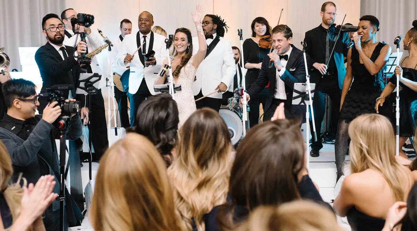 Wedding reception celebration with guests dancing