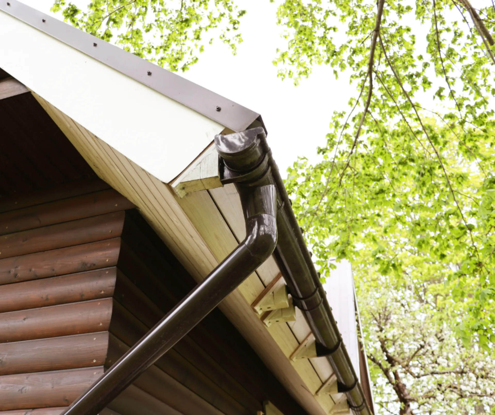 brown gutter system on a brown wooden house
