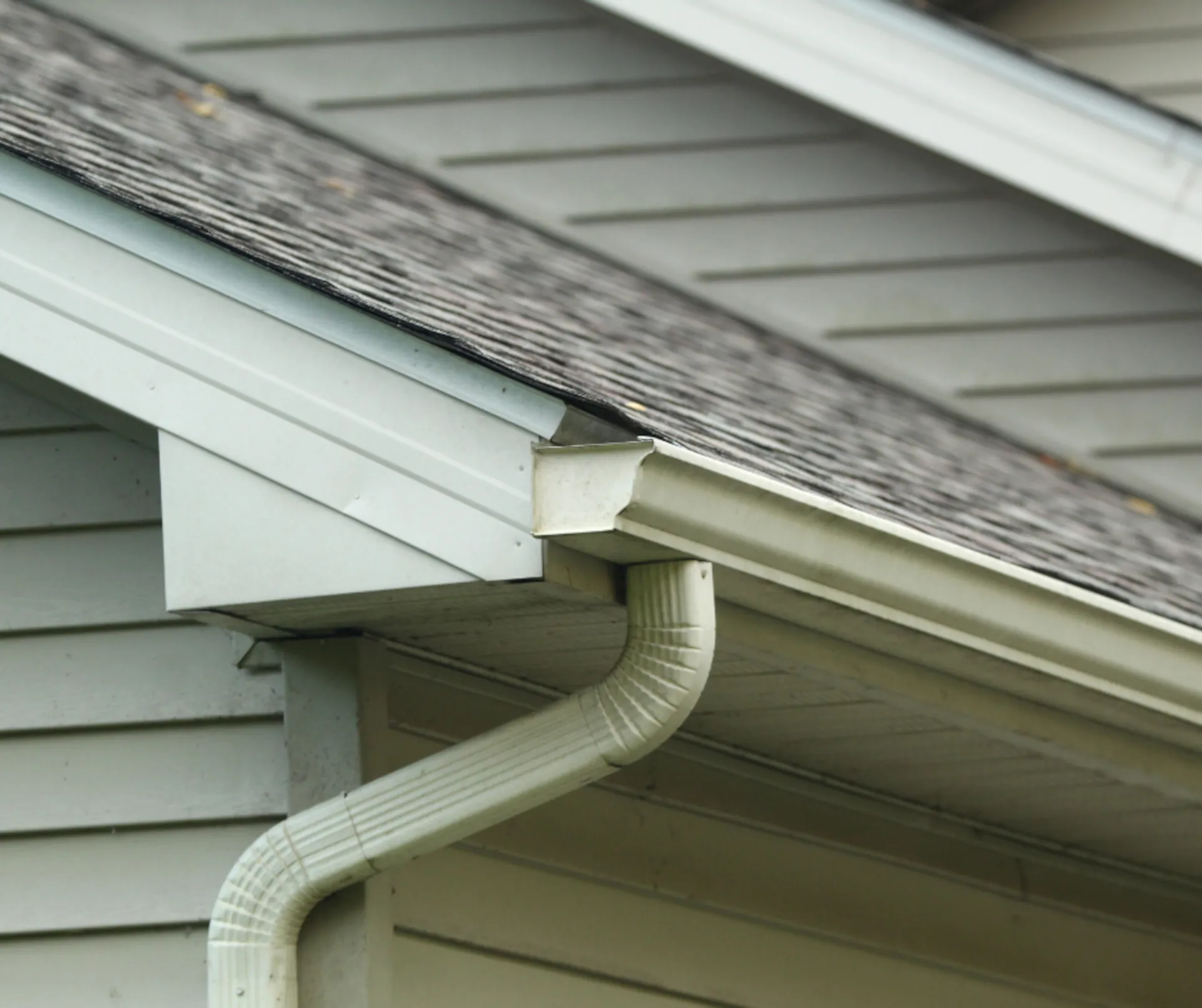 white gutter system on a white home