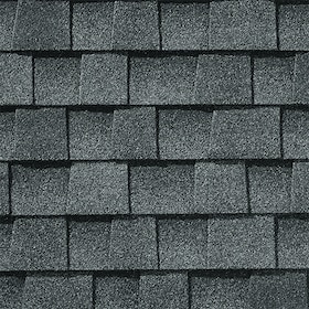 Close-up of gray asphalt roof shingles arranged in staggered rows.