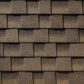 Close-up of overlapping brown textured roofing shingles.
