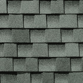 Close-up of textured gray slate roof shingles arranged in horizontal rows.