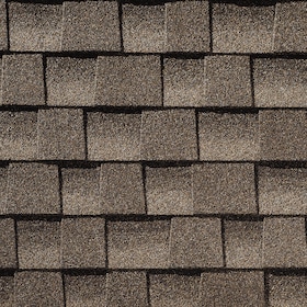 Close-up of brown asphalt roof shingles arranged in overlapping rows.