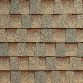 Close-up of overlapping brown and gray asphalt roof shingles arranged in a staggered pattern.