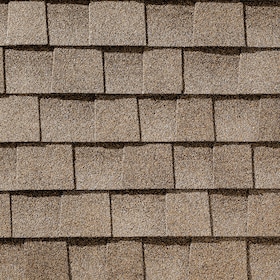 Close-up of brown asphalt roof shingles arranged in horizontal rows.