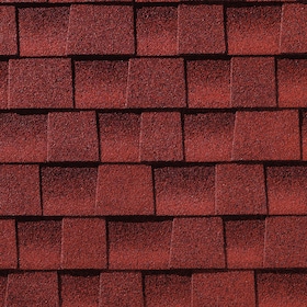 Close-up of red asphalt roof shingles arranged in a staggered pattern.