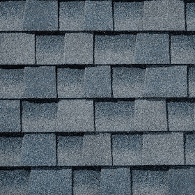 Close-up of blue-gray asphalt roof shingles arranged in overlapping rows.