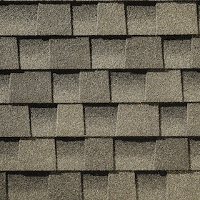 Close-up of overlapping gray asphalt roof shingles arranged in a uniform pattern.