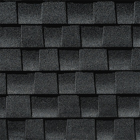 Close-up of dark gray asphalt roofing shingles arranged in overlapping horizontal rows.