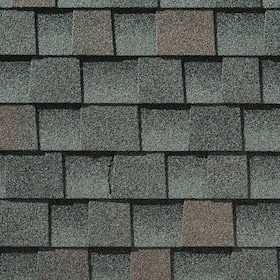 Roof shingles in a pattern of gray and muted red colors.