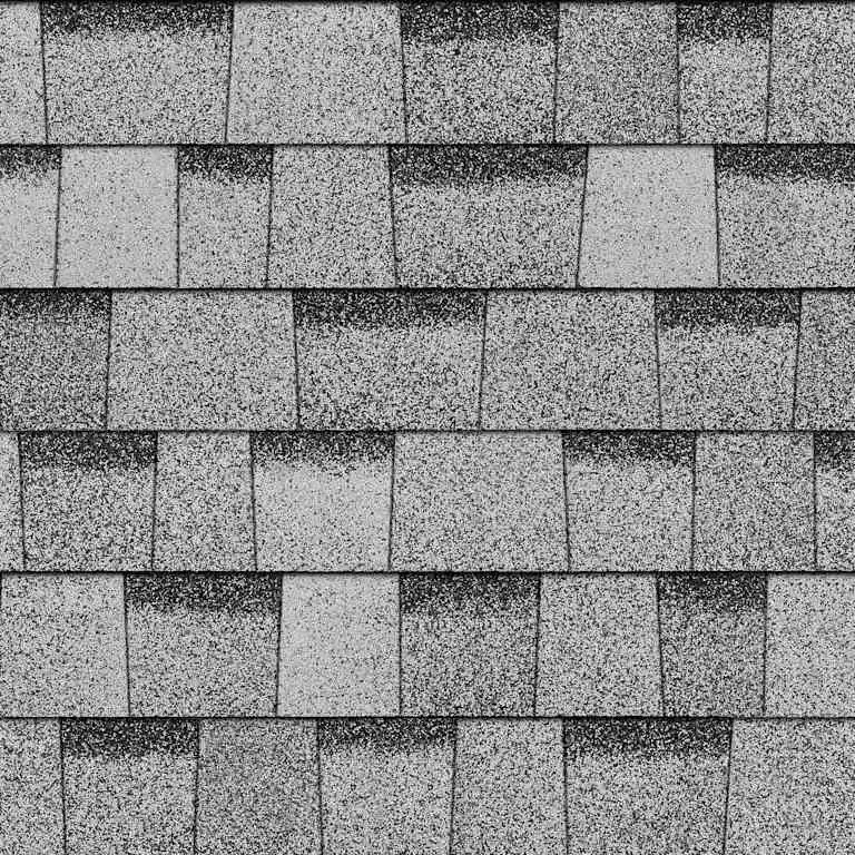 Close-up of gray asphalt shingles with a speckled, textured surface in overlapping rows.
