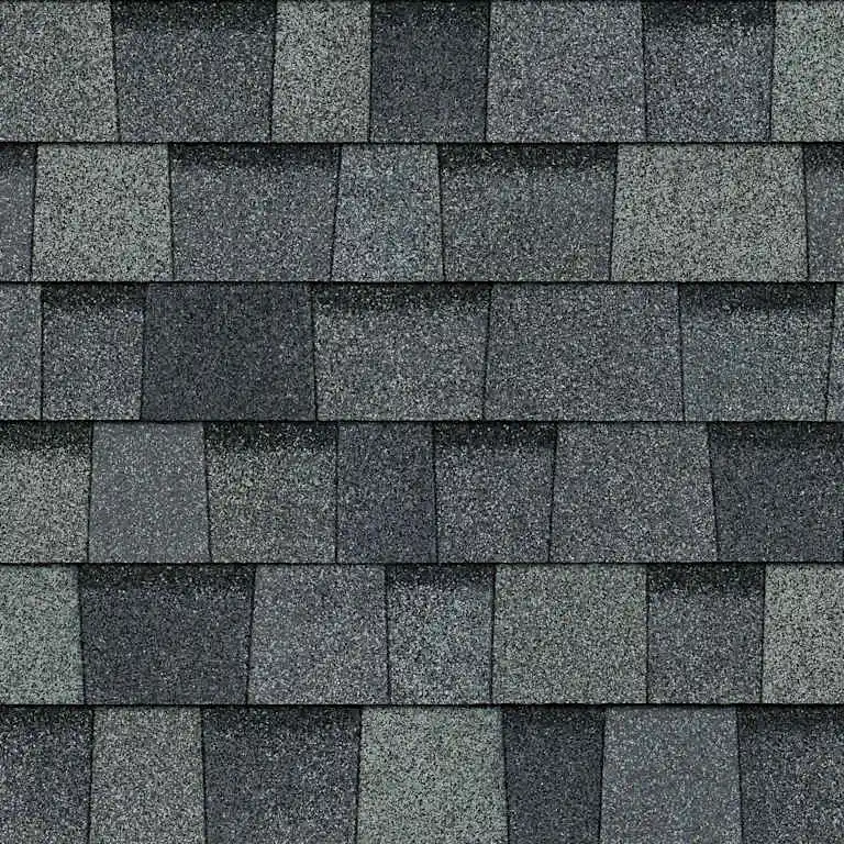 Close-up of gray asphalt roof shingles arranged in overlapping horizontal rows.