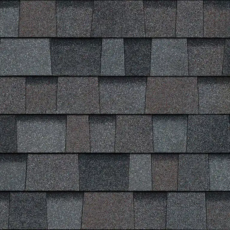 Close-up of gray and brown asphalt roof shingles arranged in rows.